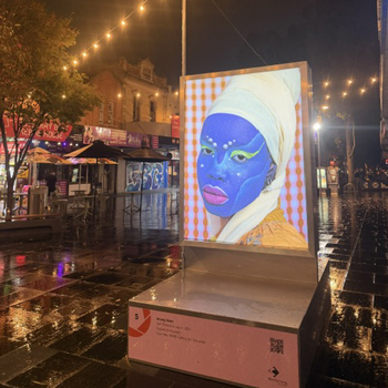 Self Portrait in July 4, 2021 by Atong Atem; lightbox on Nicholson St Mall, Footscray